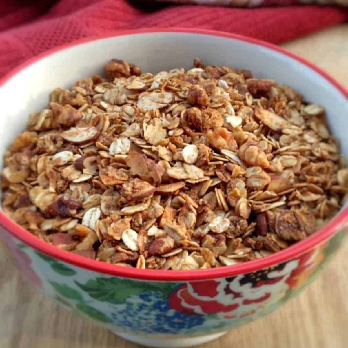 a bowl full of homemade oats and honey granola cereal.