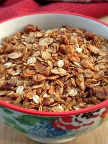 a bowl of healthy Amish granola with oats and honey.