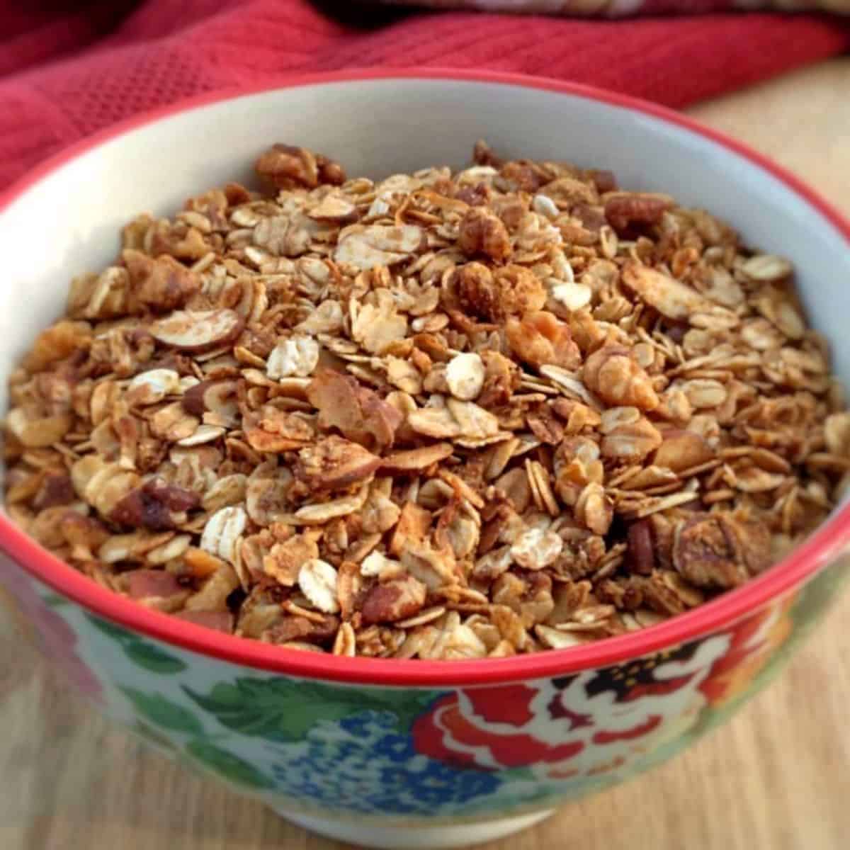 a bowl of healthy Amish granola with oats and honey.