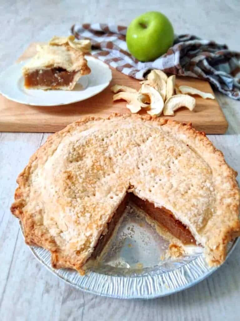 apple schnitz pie with a slice removed.