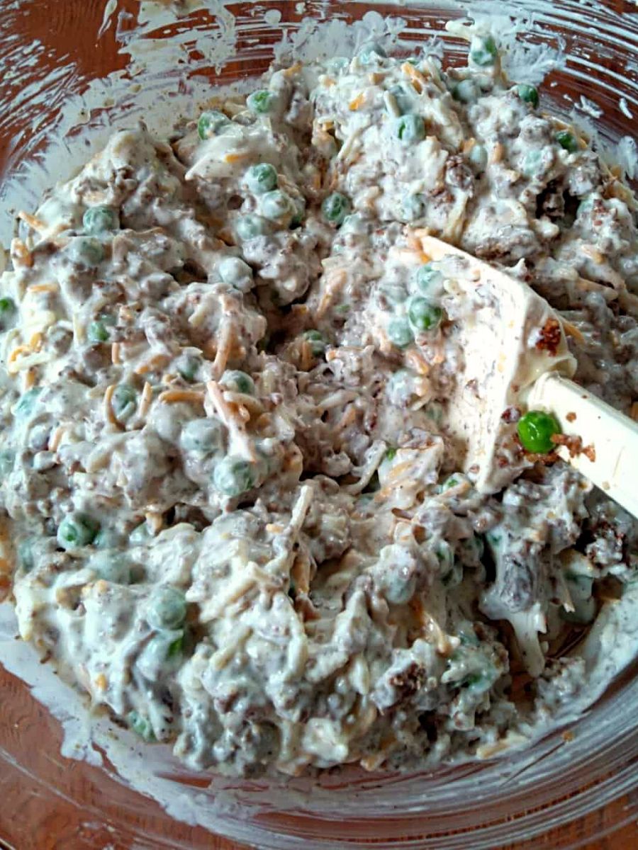 all the casserole ingredients mixed together in a big bowl.