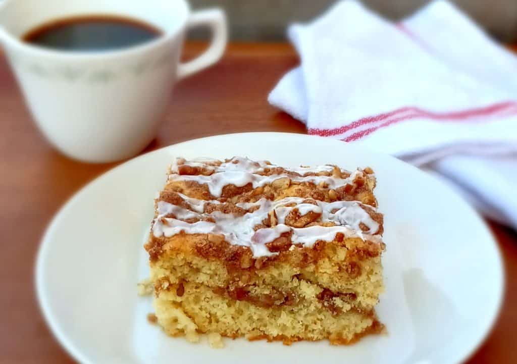 Amish cinnamon streusel coffee cake with a cup of coffee