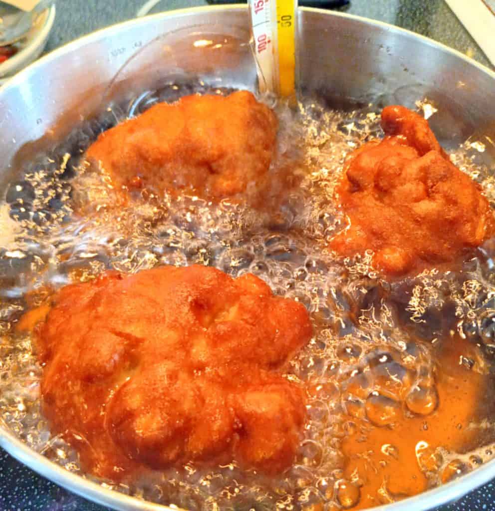 Frying Amish apple fritters