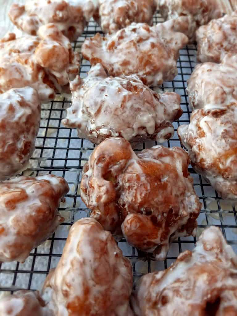 Old-fashioned Amish Apple Fritters cooling on the rack