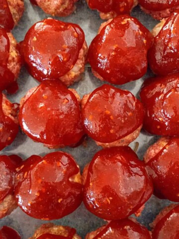 a 9x13" pan of Homemade Amish BBQ meatballs ready to bake