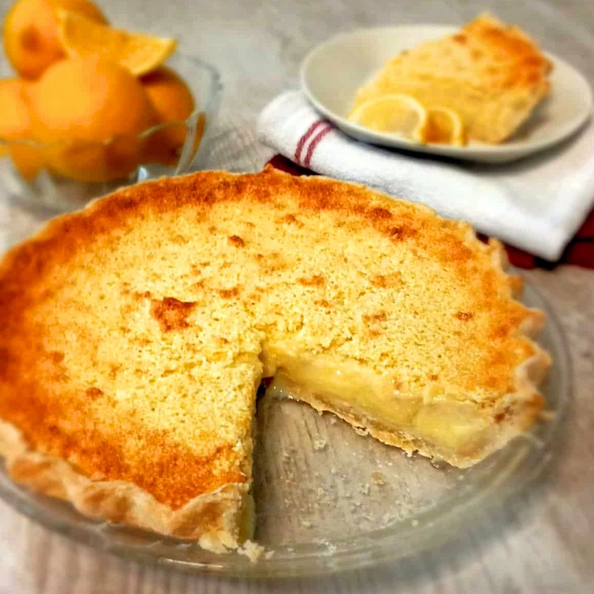 a 9" Amish lemon pie with a slice taken out.