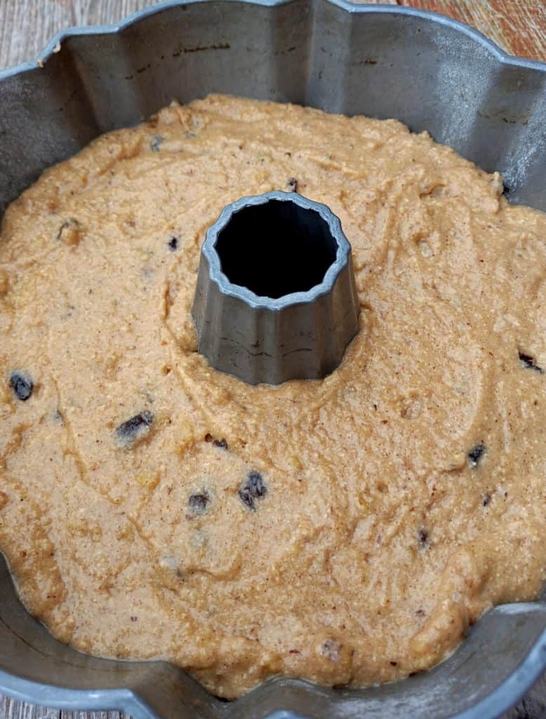applesauce cake batter in bundt pan