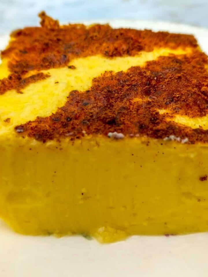 close up of a slice of egg custard on a plate.
