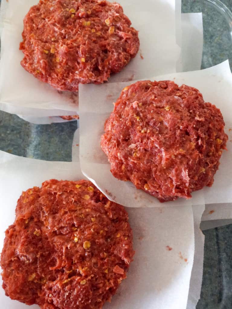 hamburgers with parchment paper between them