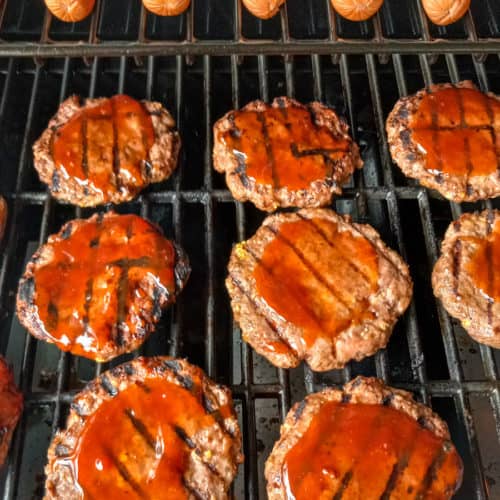 hamburgers and hot dogs on the grill