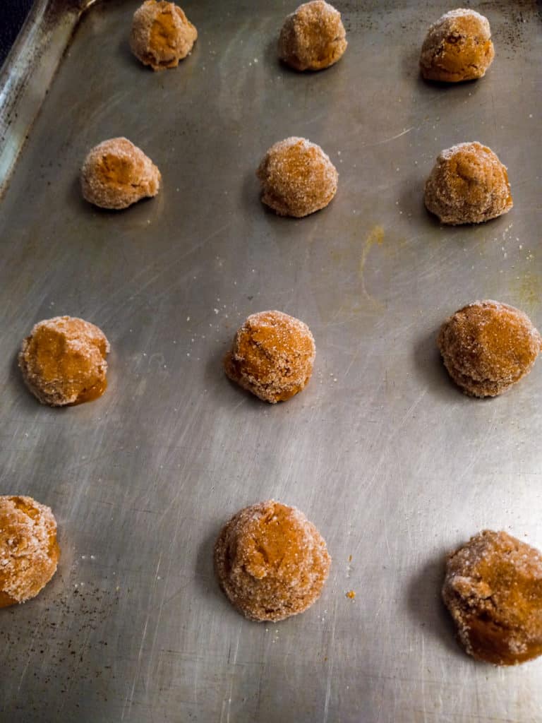cookie dough balls on baking sheets