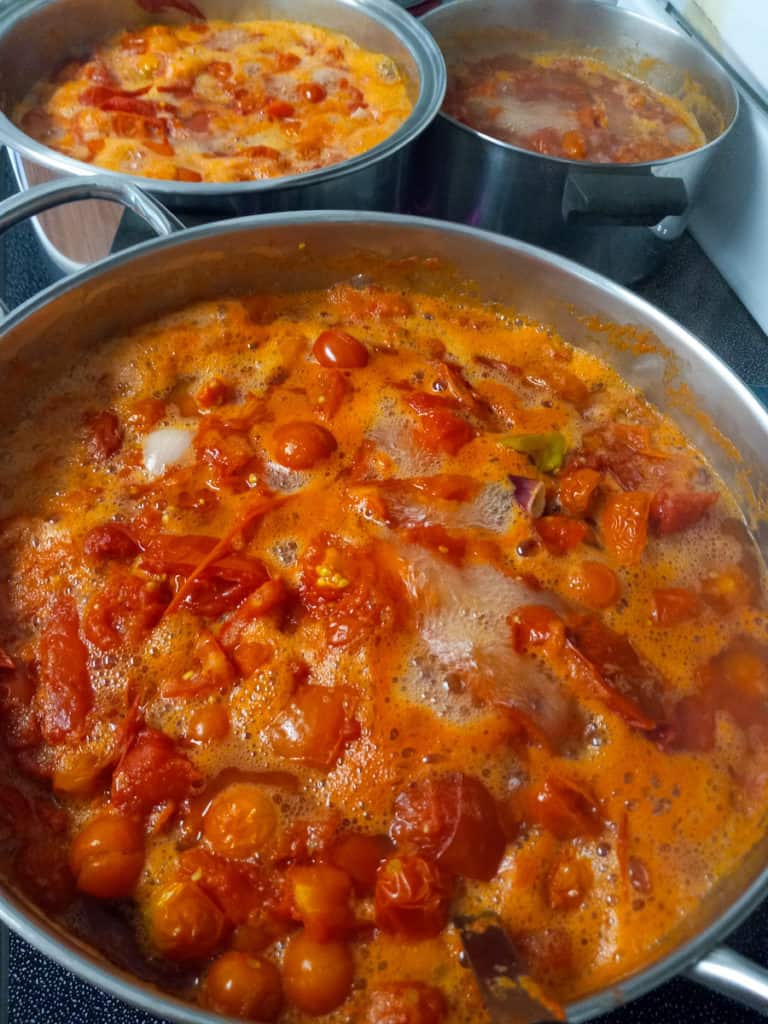 cooking pots of tomatoes for sauce