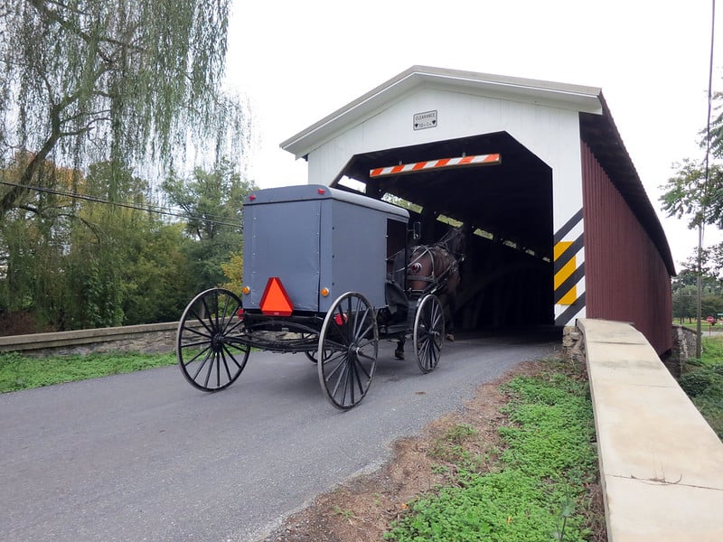 Amish-horse-and-buggy-heading-into-covered-bridge.