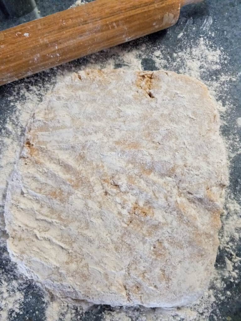 cookie dough on floured countertop