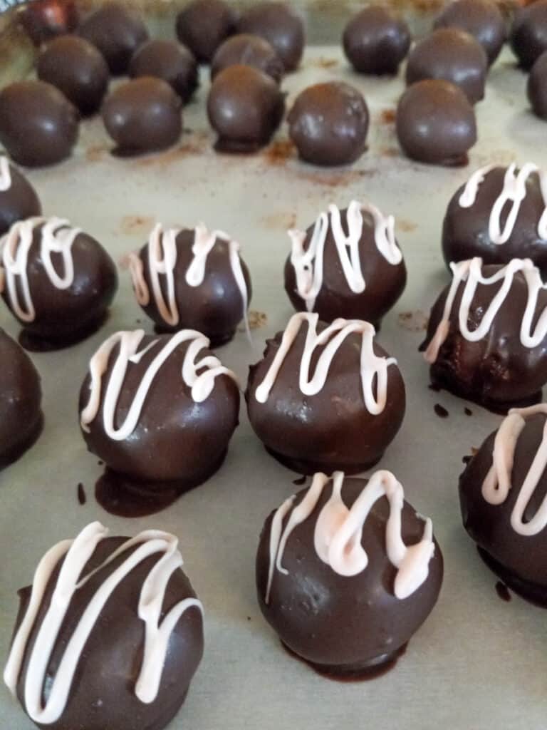 chocolate dipped truffles on sheet pan