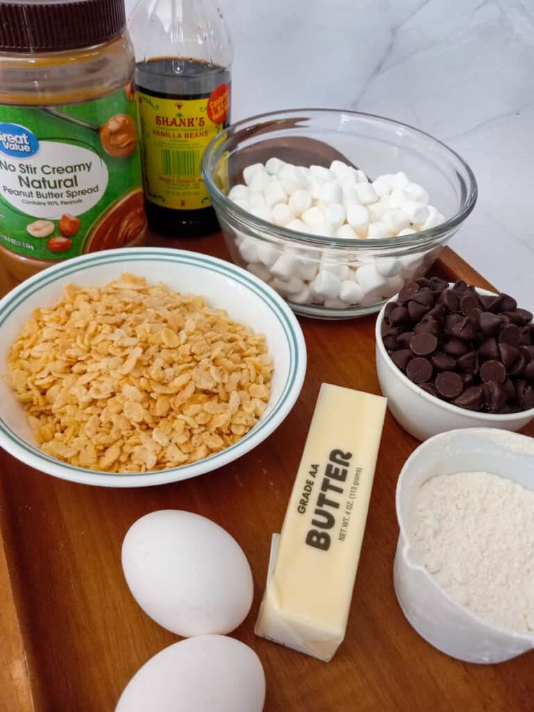 ingredients - rice Krispies, peanut butter, marshmallows, chocolate chips,, butter, eggs, and flour