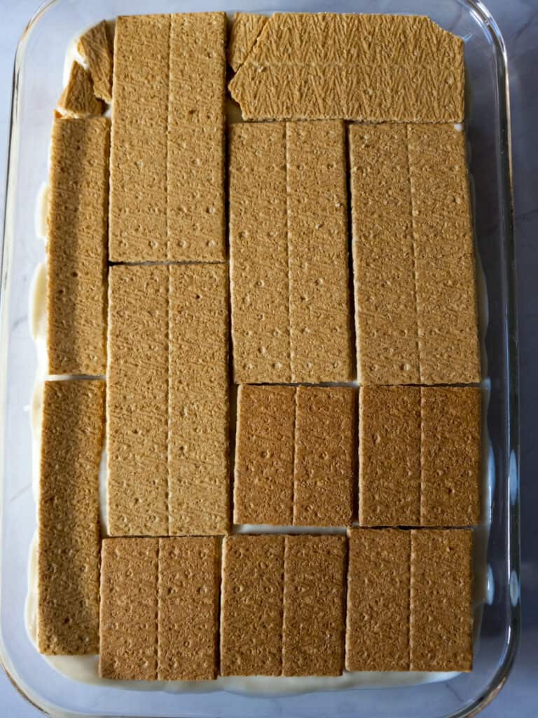 pudding in a dish with graham crackers layered on top