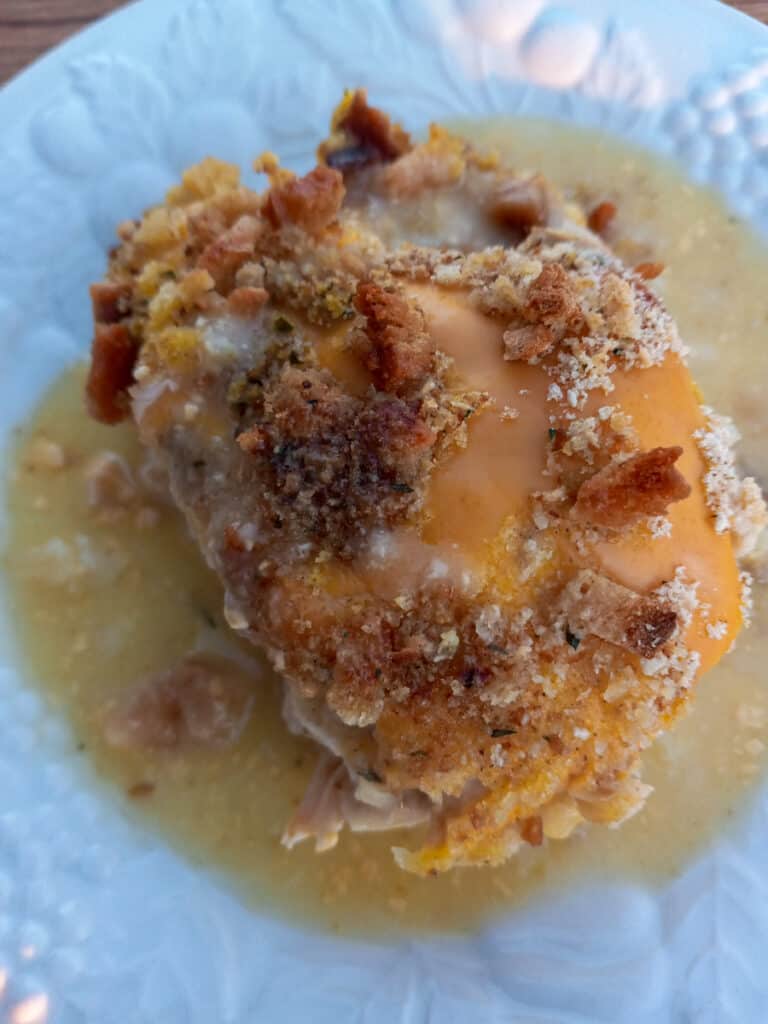Amish chicken breast with creamy sauce on a plate