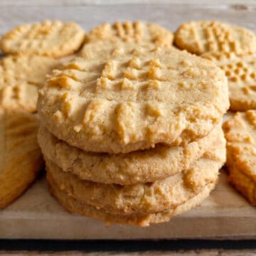 stack of Amish pb cookies on a board.
