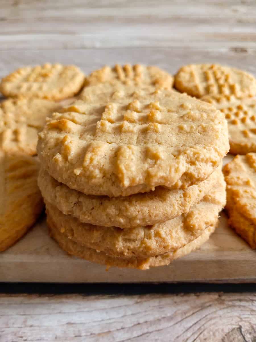 stack of Amish pb cookies on a board.
