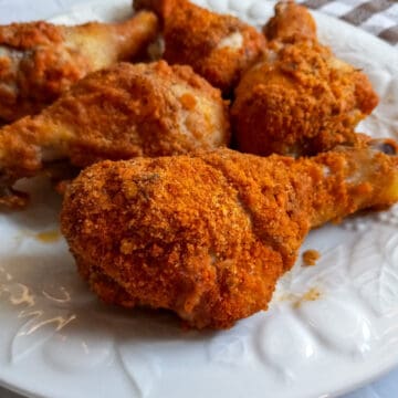 plate full of oven-fried chicken legs