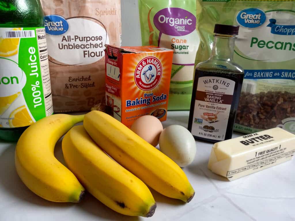 Ingredients: bananas, lemon juice, flour, soda, sugar, vanilla, butter, eggs, and pecans