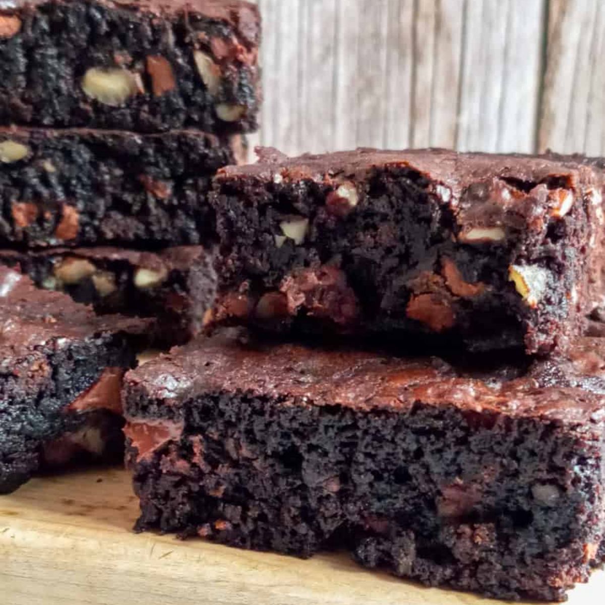 a stack of easy double chocolate homemade Amish brownies with nuts.