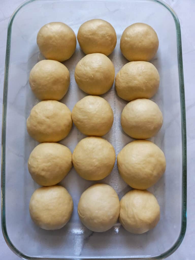 dough balls in 9x13 pan, ready to rise