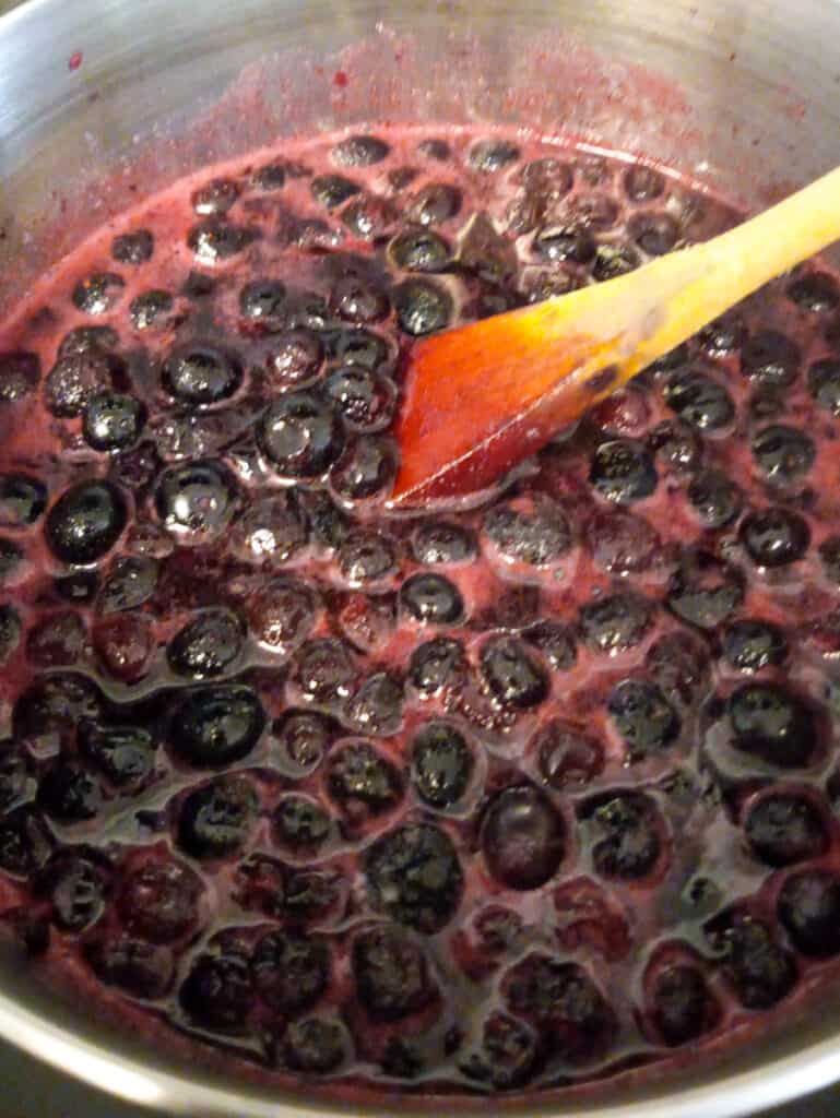 cooking blueberries in a pot