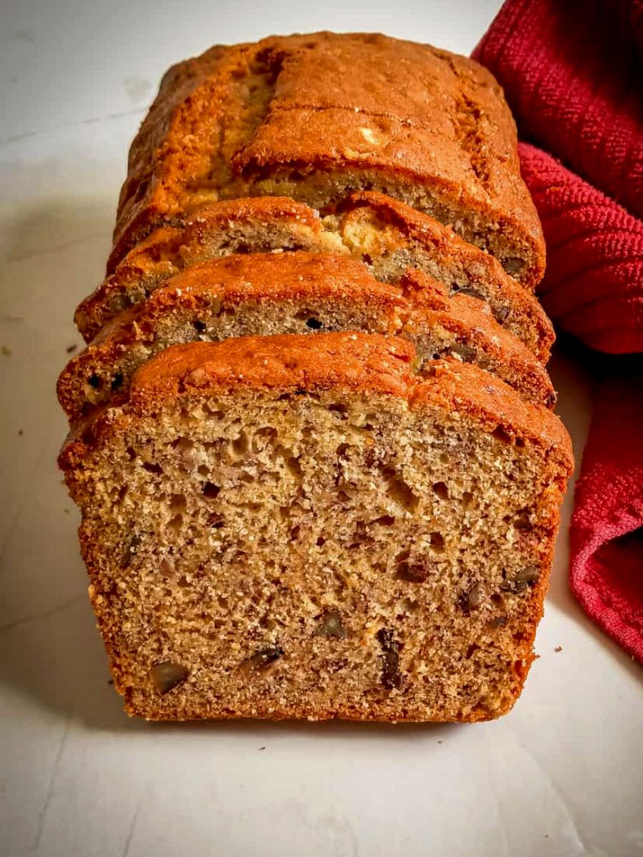 beautiful slices of banana nut bread made in only one loaf pan so it's larger slices.