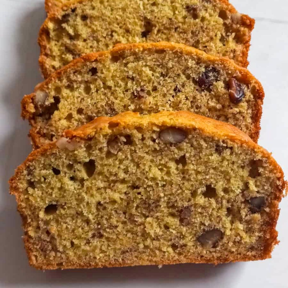 Amish banana bread slices that were baked in two loaf pans creating smaller slices.