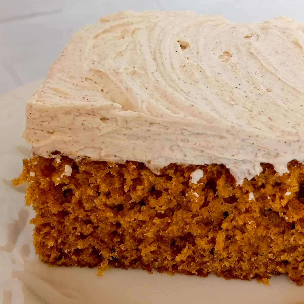 slice of spice cake with cinnamon buttercream frosting