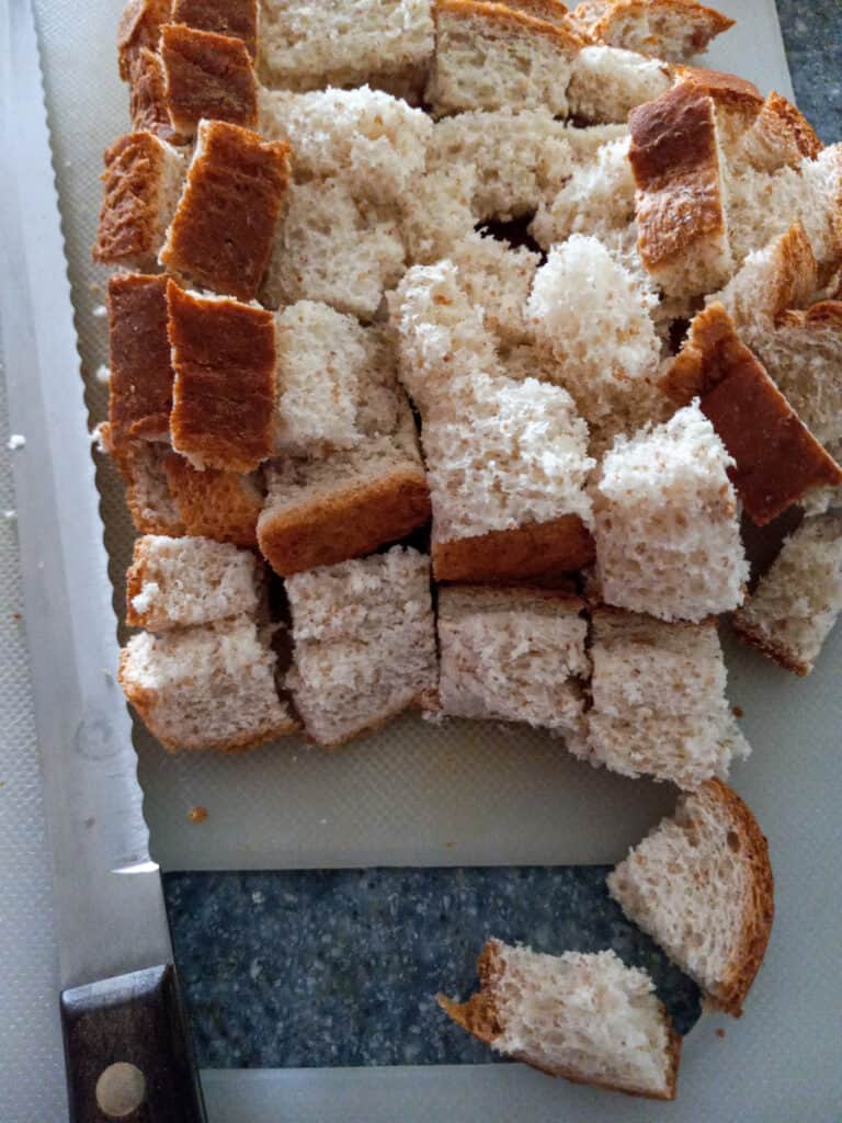 cutting bread slices into cubes