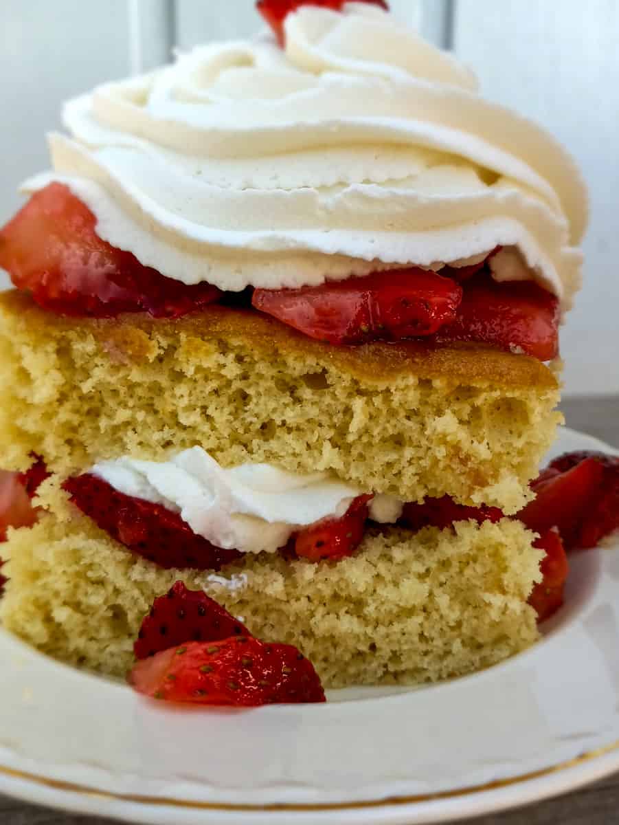 slice of shortcake piled with berries and whipped cream