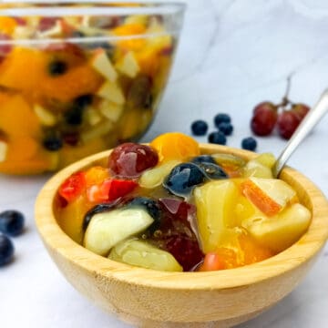 2 bowls of fruit salad in sauce