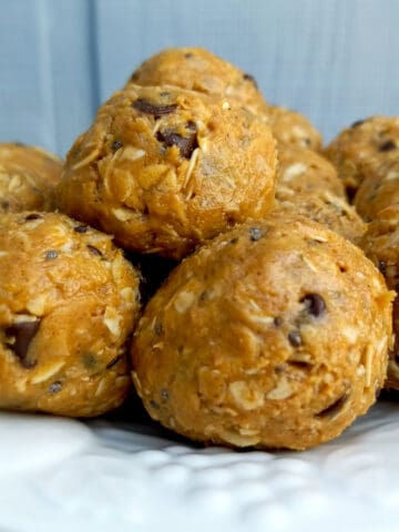 Amish homemade peanut butter protein balls stacked on a plate