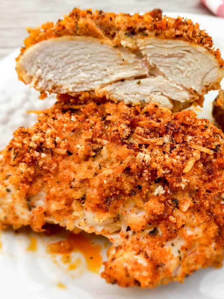 chicken breasts coated in bread crumbs and parmesan cheese