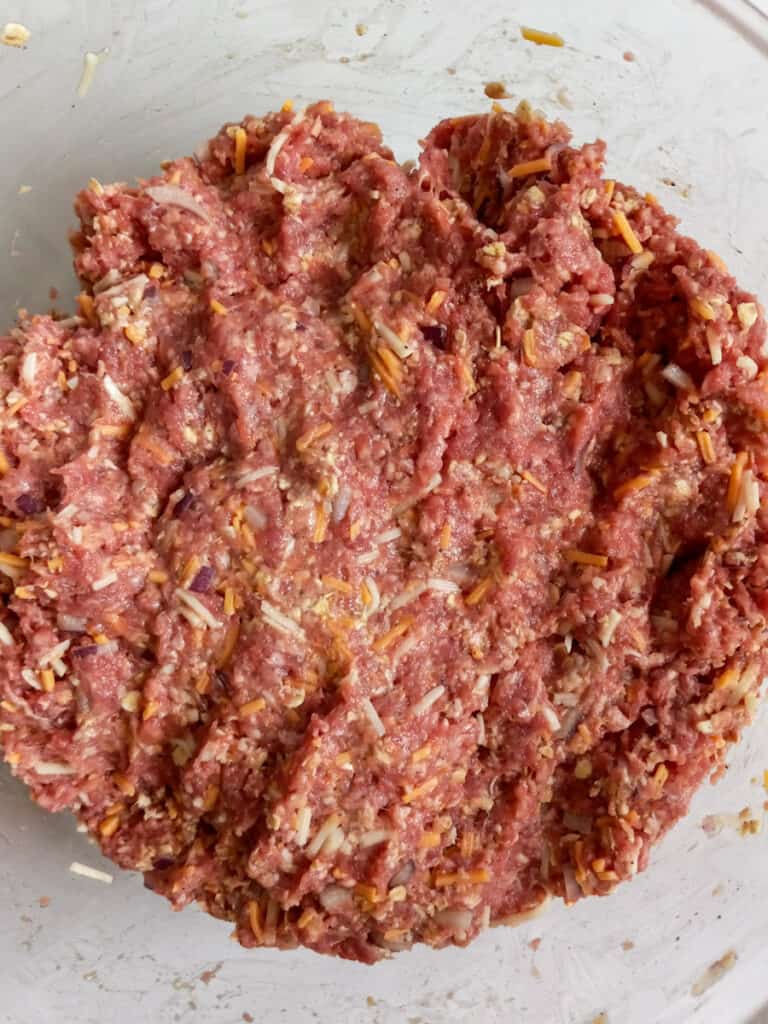 mixed meatloaf in a bowl, ready to shape into loaves