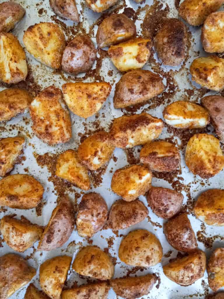 oven-roasted parmesan potatoes on a large baking tray
