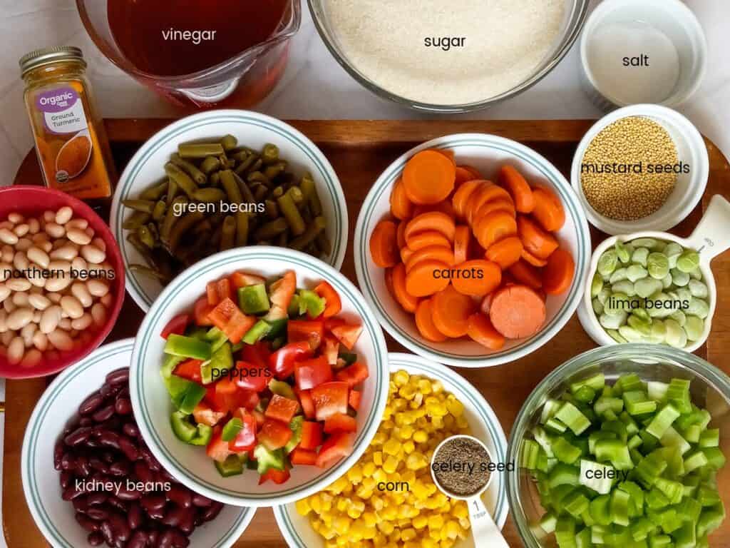 Ingredients: kidney beans, northern beans, corn, carrots, celery, green beans, lima beans, peppers, mustard seed, celery seed, turmeric, sugar, vinegar, and salt