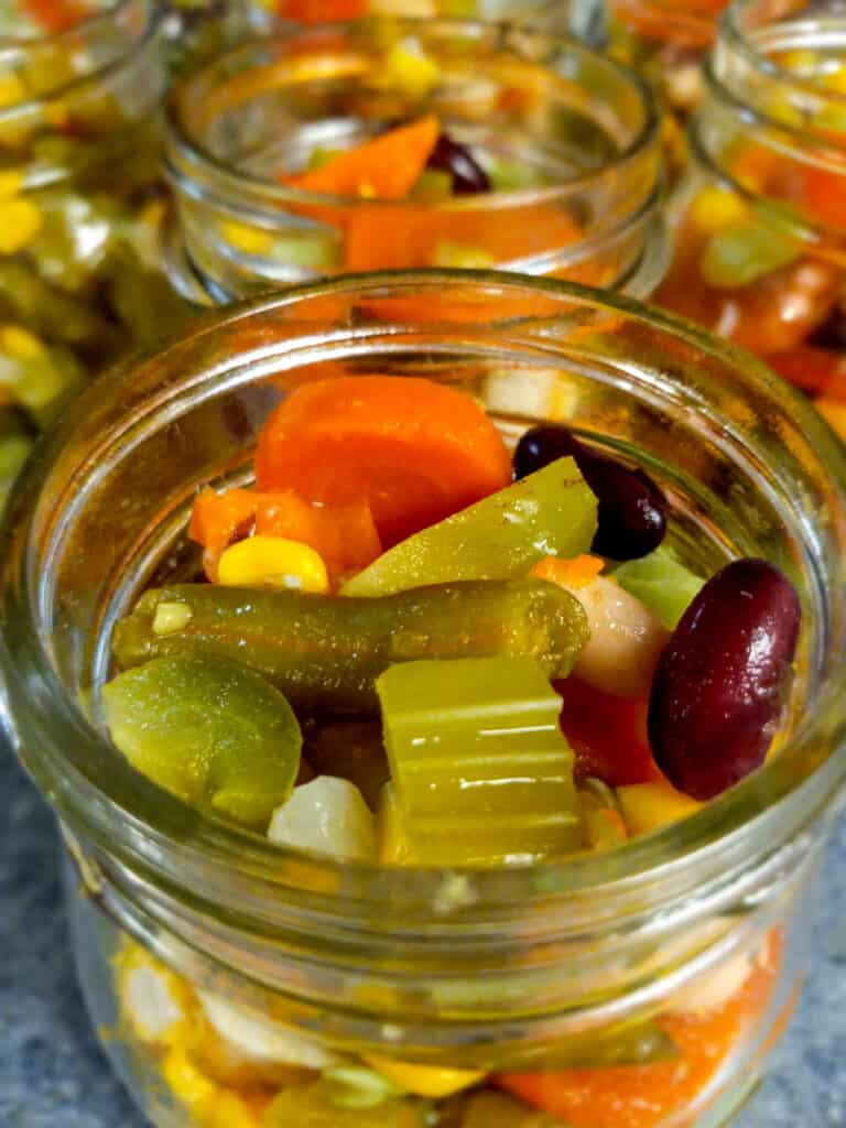 jars filled with mixed beans and vegetables