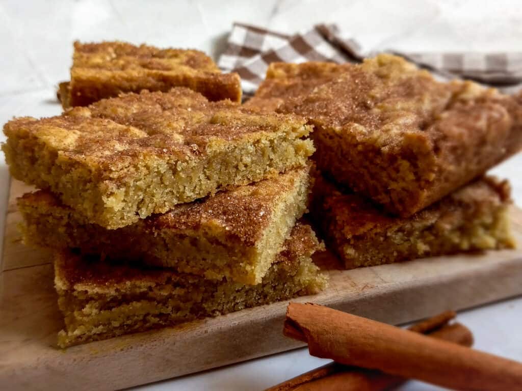 stack of snickerdoodle bars on a board.