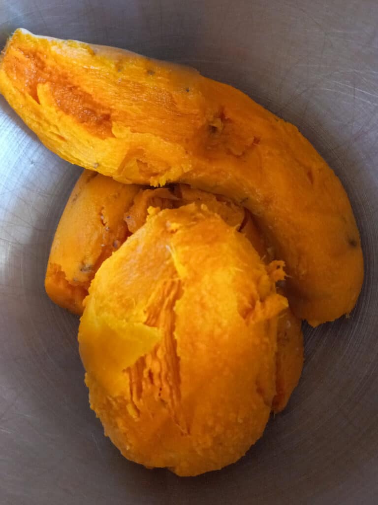 cooked and peeled sweet potatoes in a bowl.