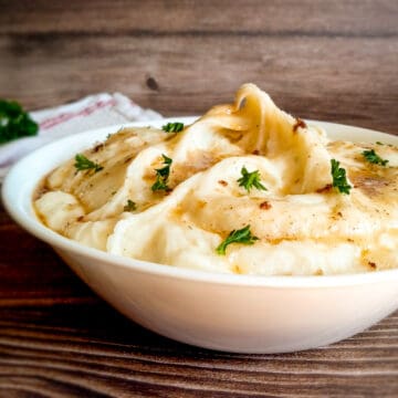 bowl of mashed potatoes with brown butter.