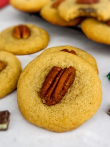 Amish mint surprise cookies topped with pecans.