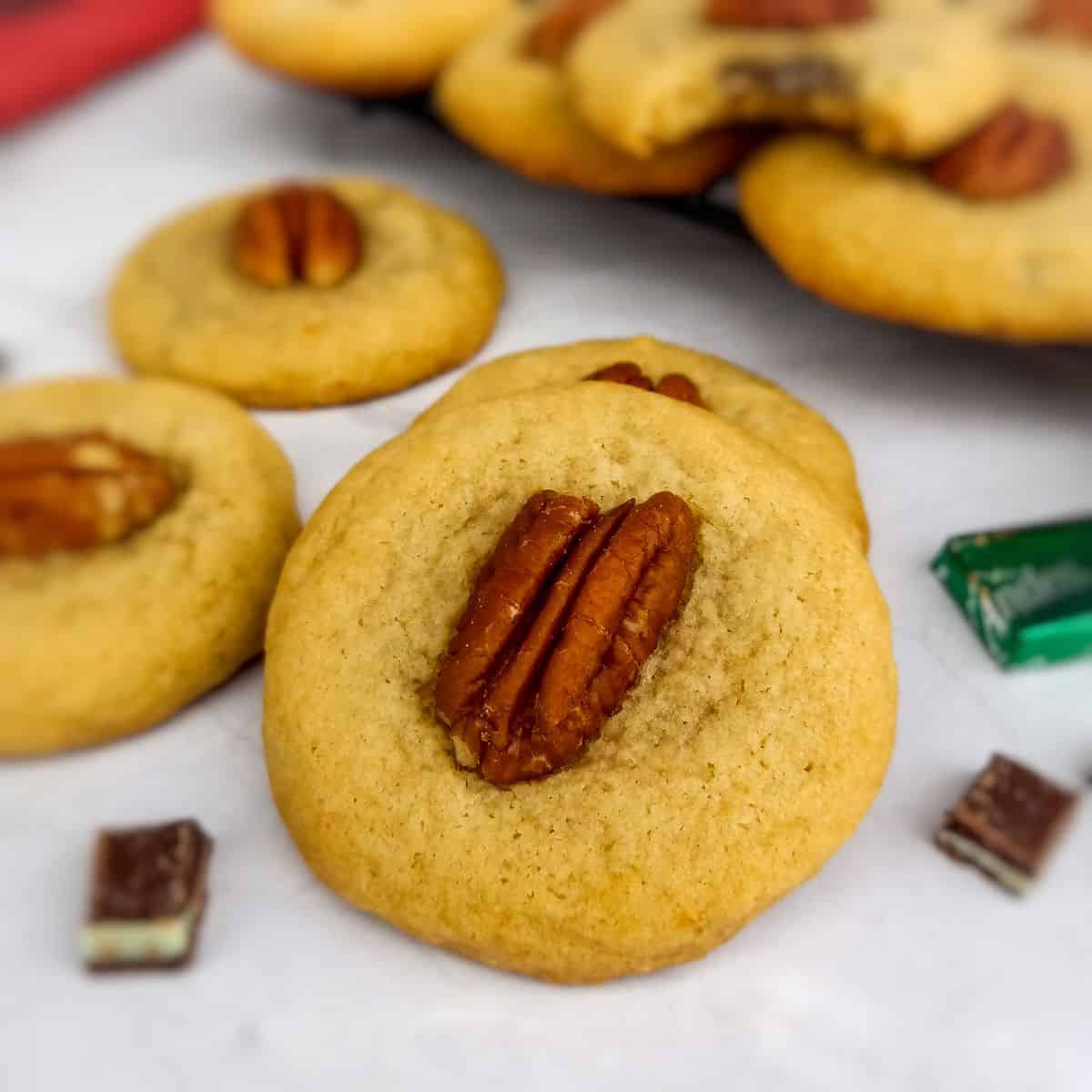 Amish mint surprise cookies topped with pecans.