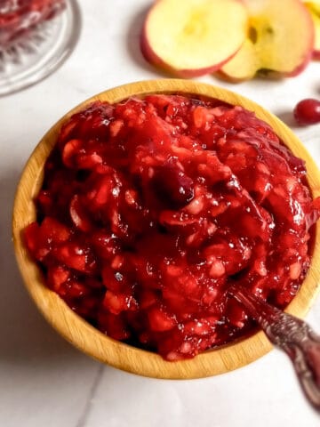 a small bowl of Amish cranberry apple jello salad.