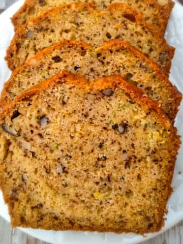 amish zucchini bread slices on a plate.