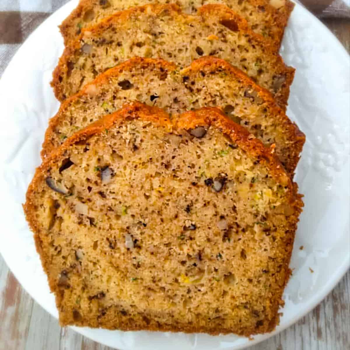 amish zucchini bread slices on a plate.