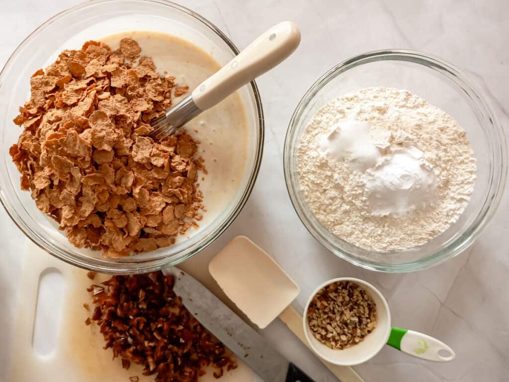 mixing the batter, adding bran flakes, and a separate bowl with dry ingredients.